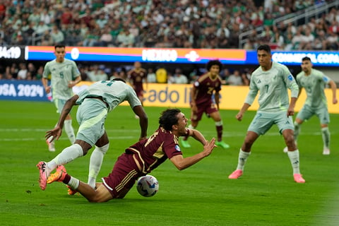 Julian Quinonez, left, fouls Jon Aramburu